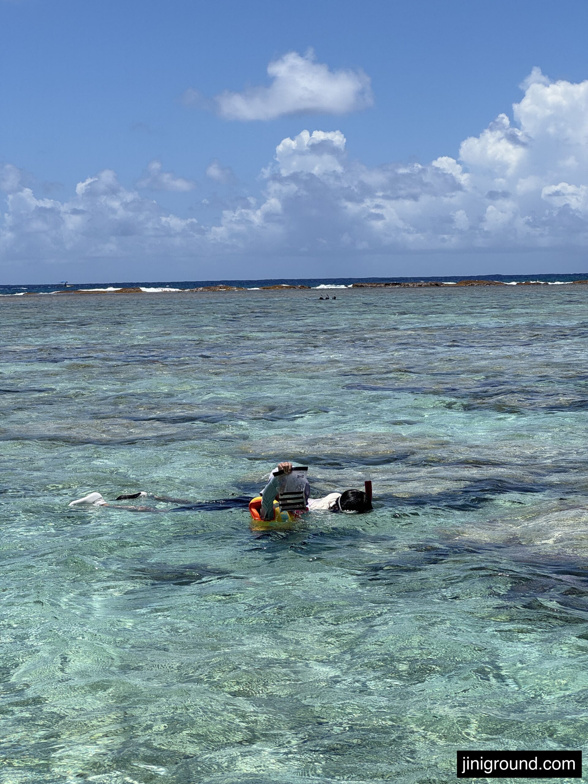 boy playing in crystal clear shallow water at Ritidian Beach Guam