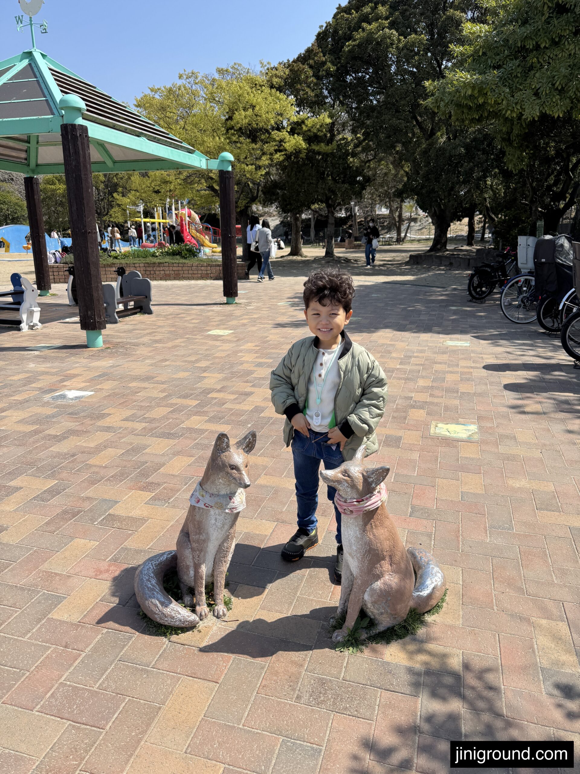 60 month old boy sitting on animal statue at Ohori Park Fukuoka Japan