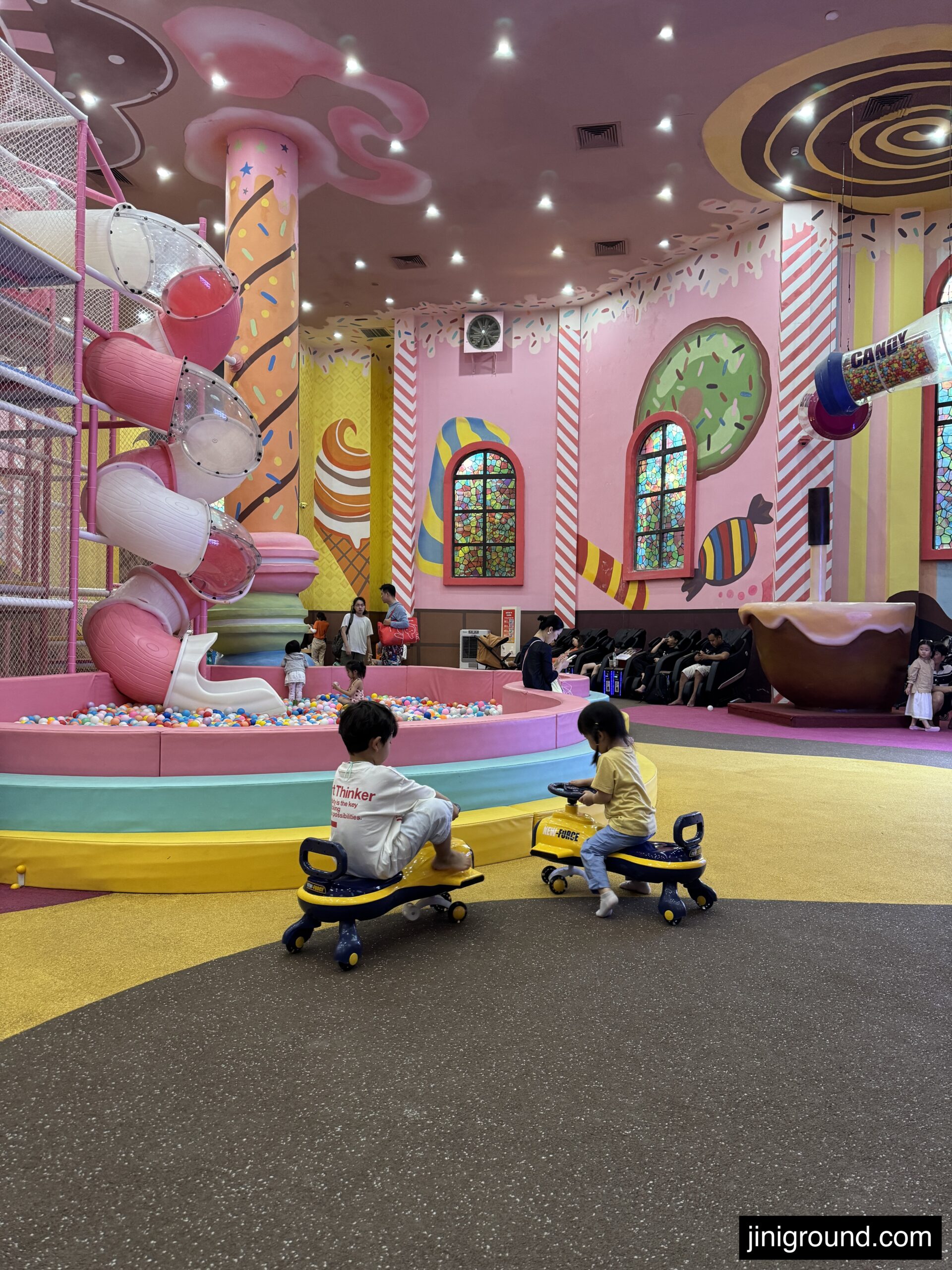 Colorful candy themed indoor kids ride area at VinWonders Nha Trang amusement park