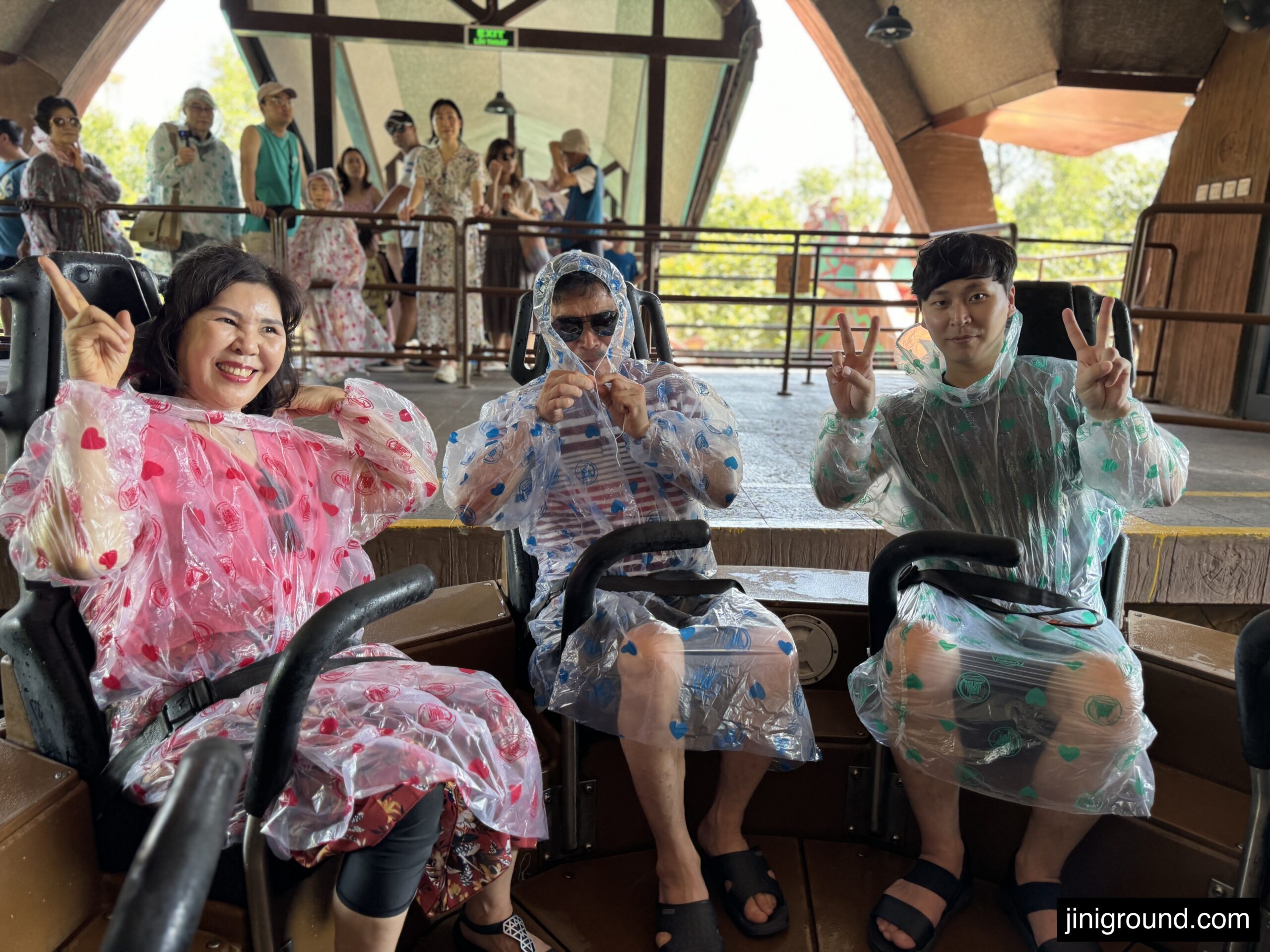 Child sliding down orange water slide at VinWonders Phu Quoc water park