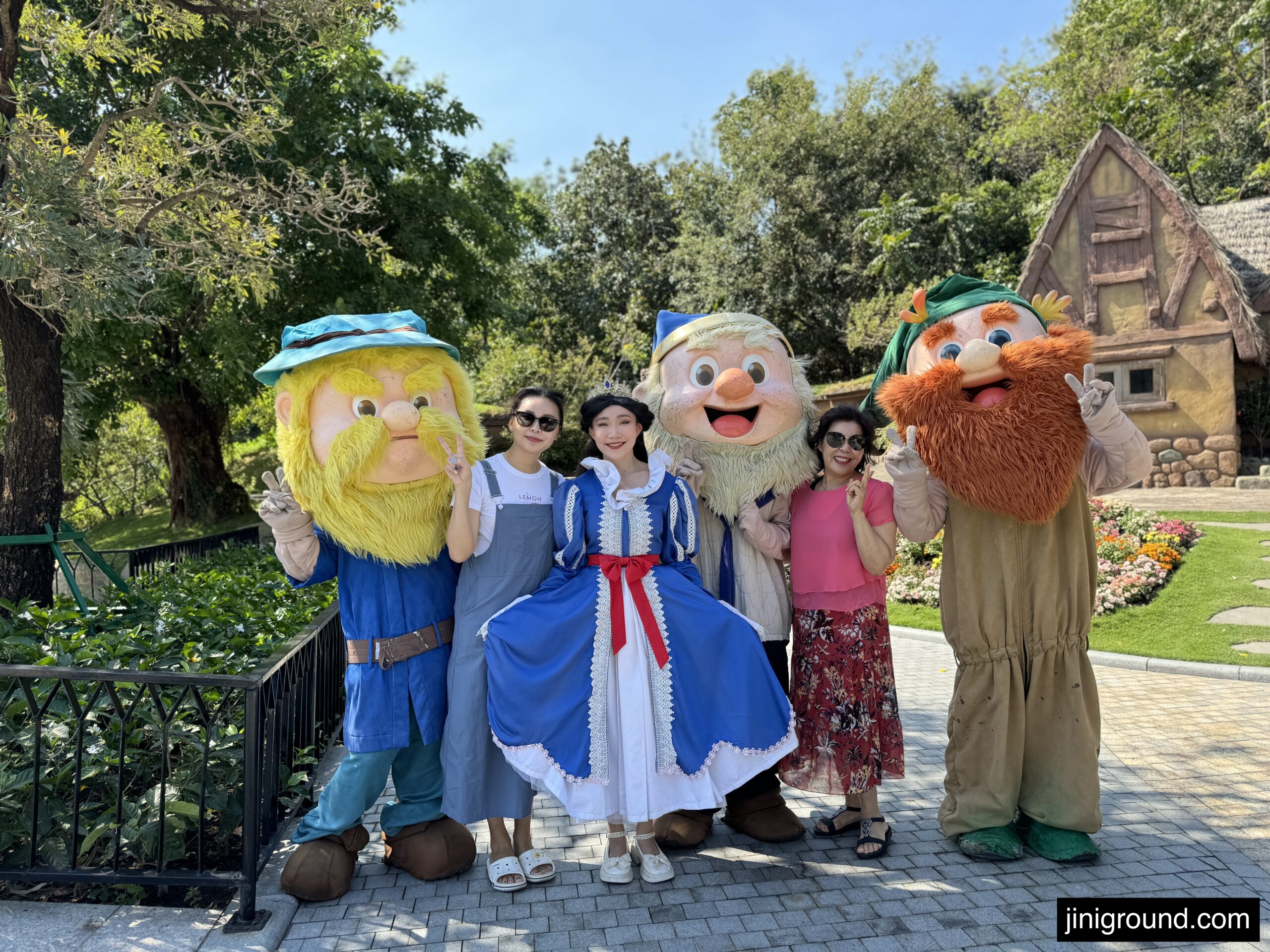 Family with colorful character mascots at VinWonders Phu Quoc entertainment area
