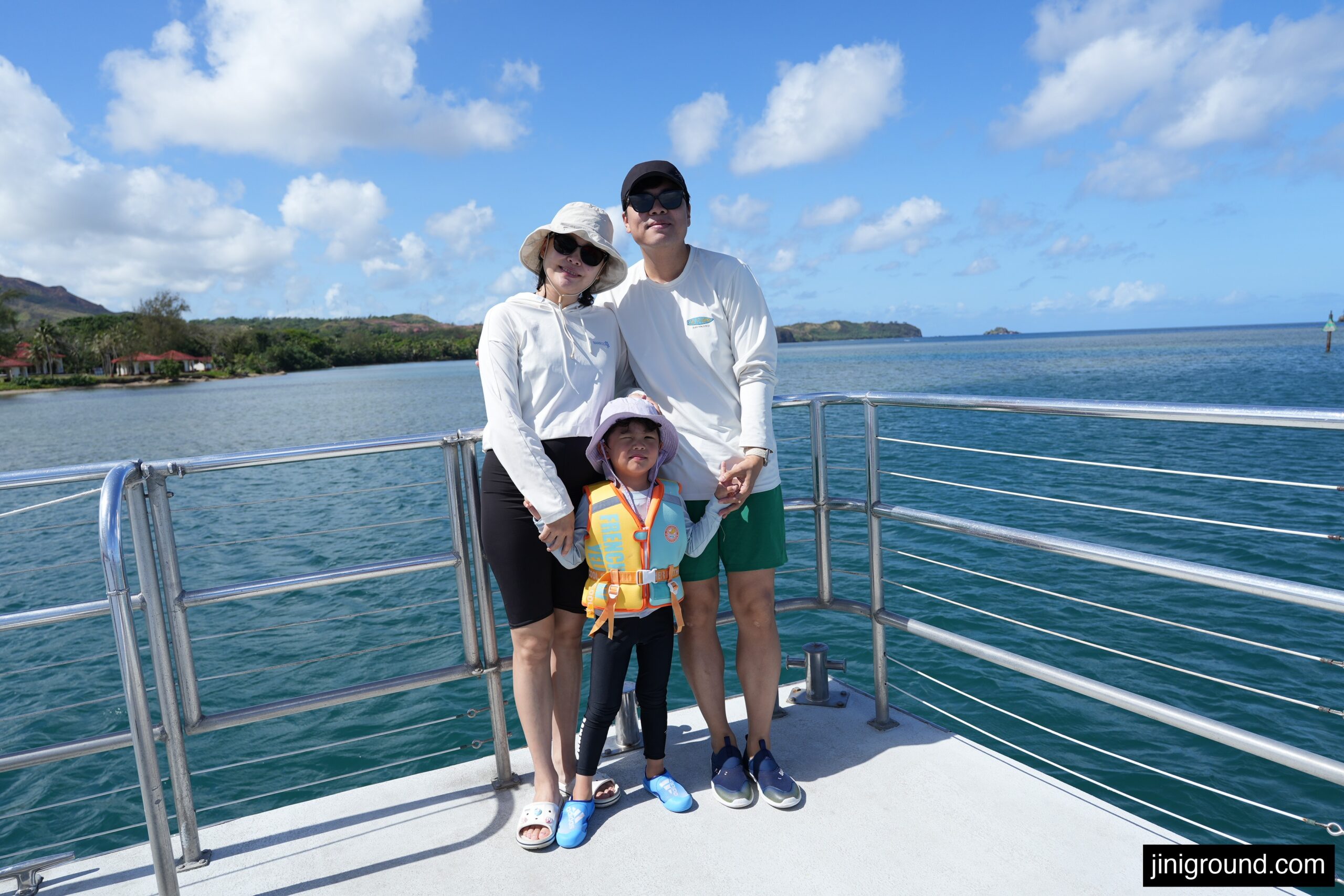 family photo on dolphin cruise boat deck with ocean view in Guam