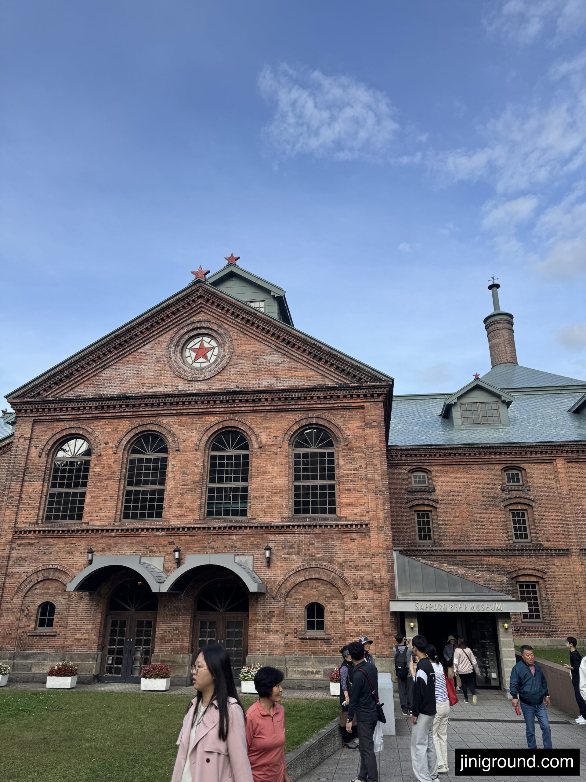 Historic red brick Sapporo Beer Museum building with distinctive architecture