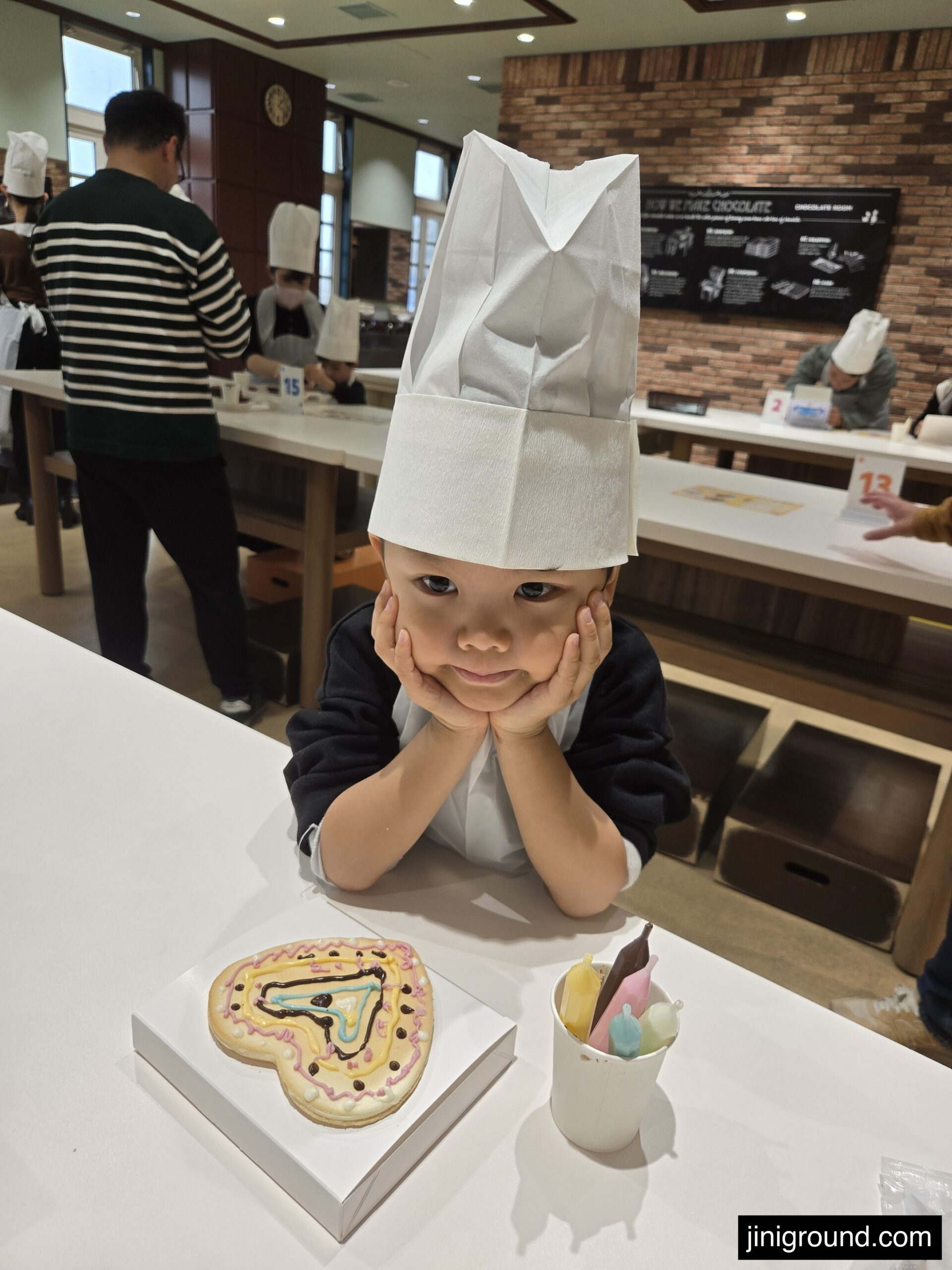 Family members viewing underwater marine life through large aquarium tunnel