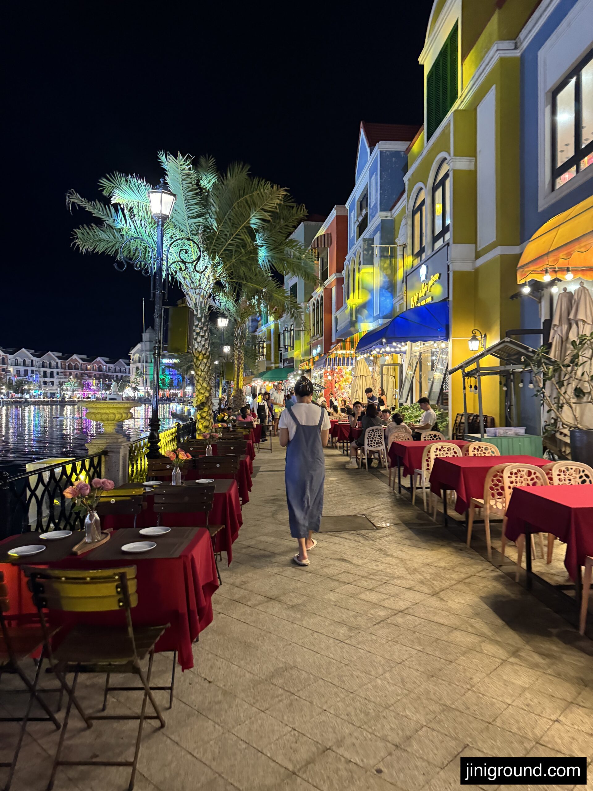 Child splashing down colorful water slide at VinWonders Phu Quoc park