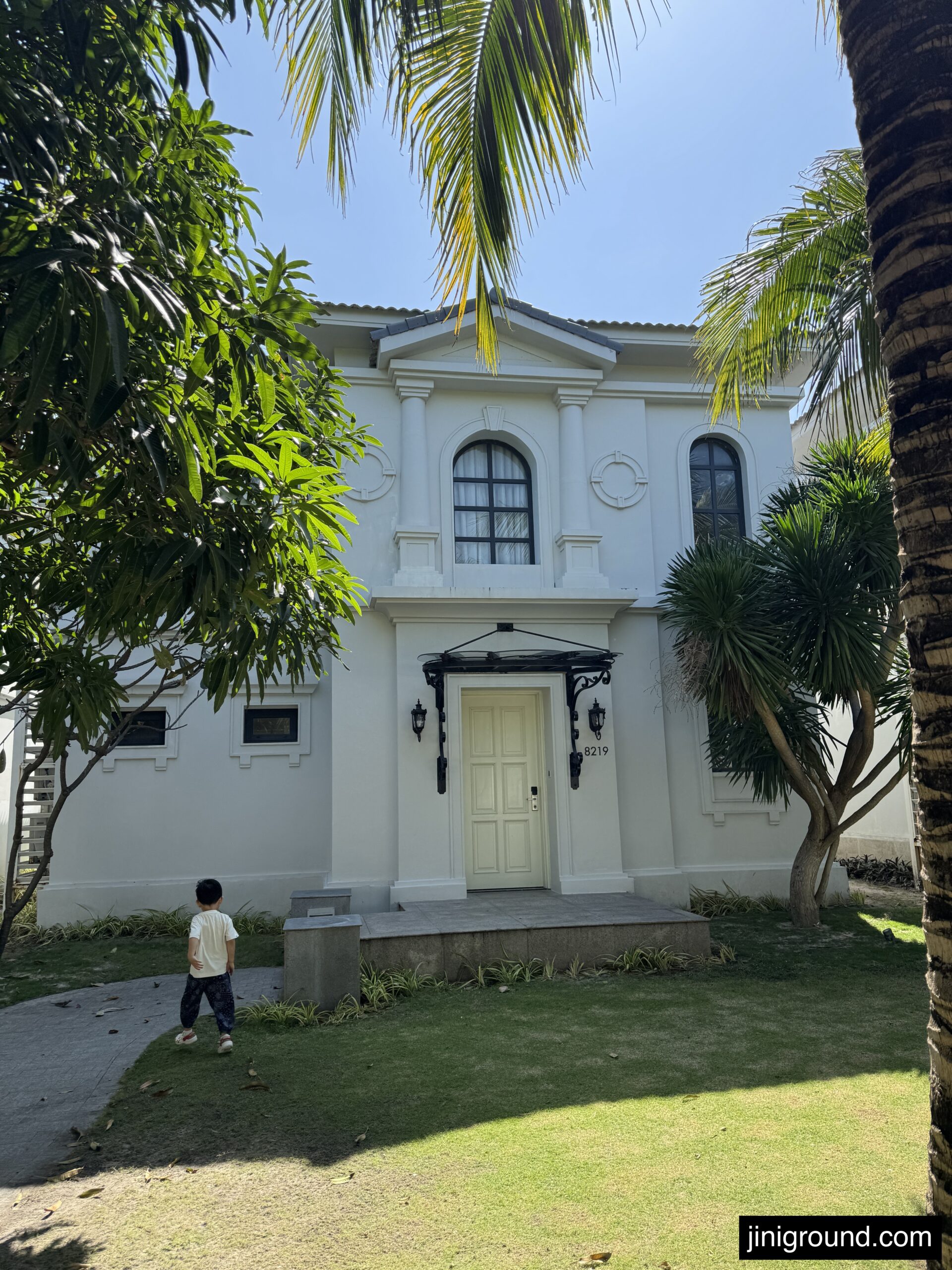 White colonial style three bedroom pool villa exterior at Vinpearl Cam Ranh Beach Resort Nha Trang