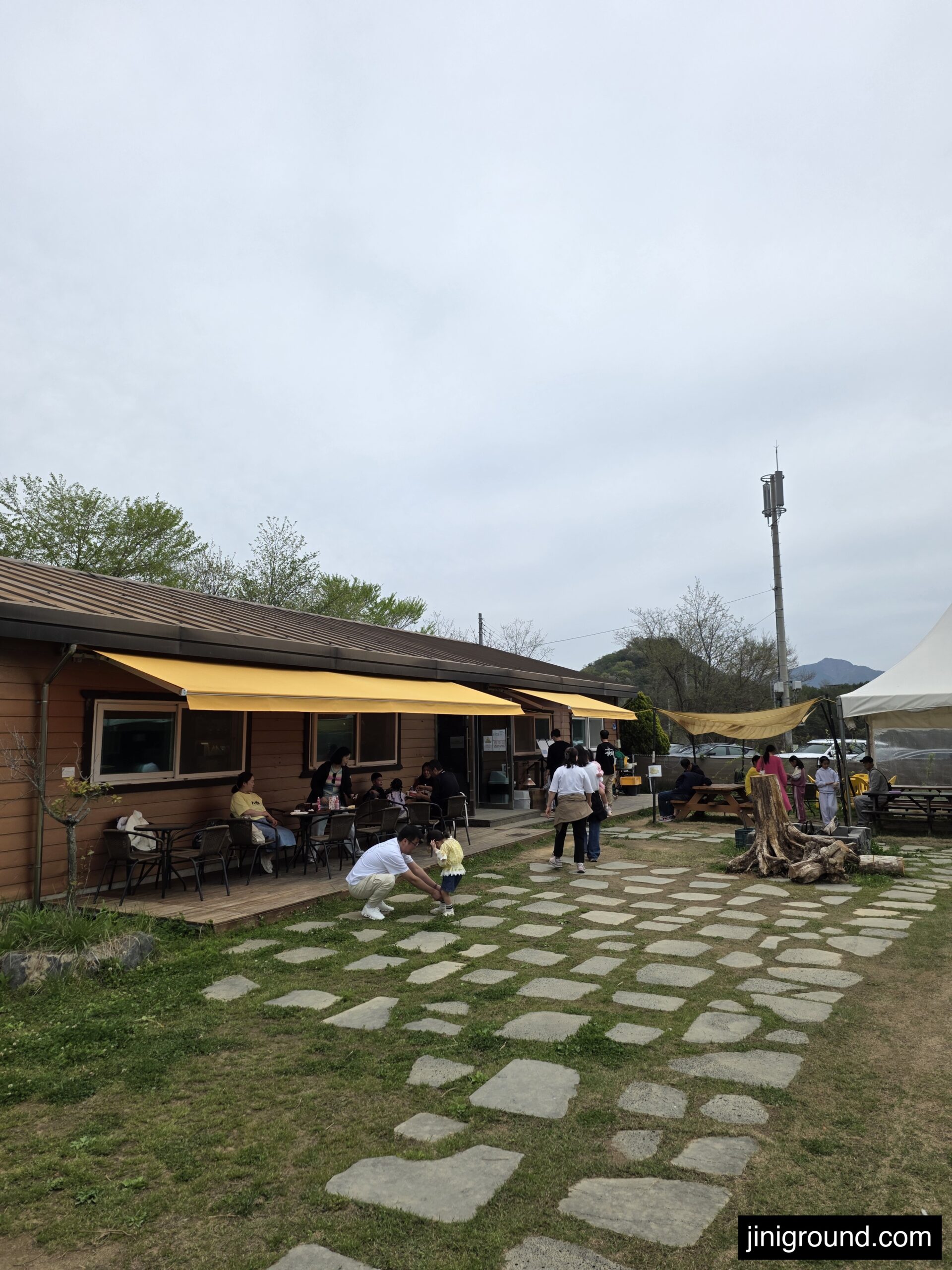 outdoor cafe terrace with yellow canopy at Dinosaur Ostrich Farm Goseong Korea
